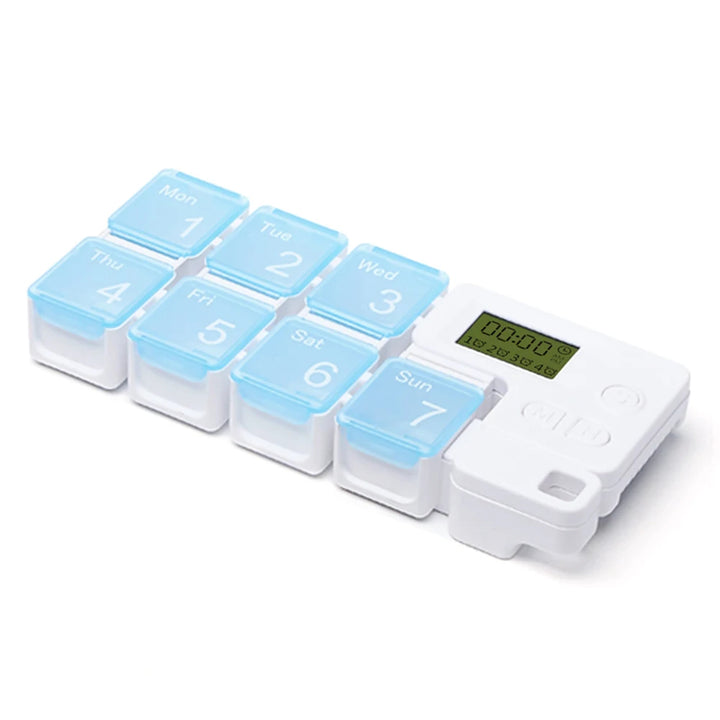 Weekly pill organizer with digital display on a white background