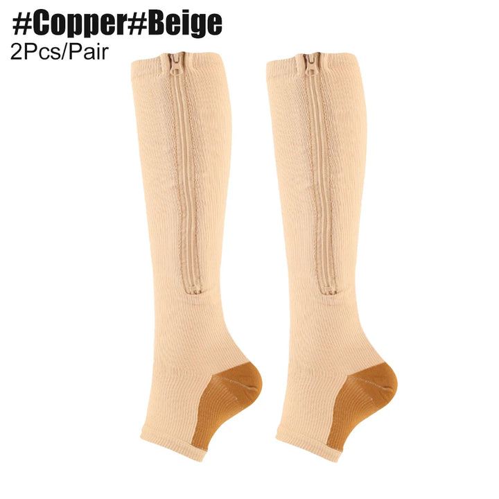 Beige knee-high socks with gold accents on a white background