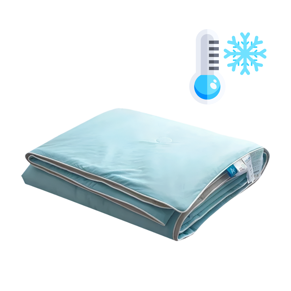 Folded light blue quilt with a thermometer and snowflake icon on a white background