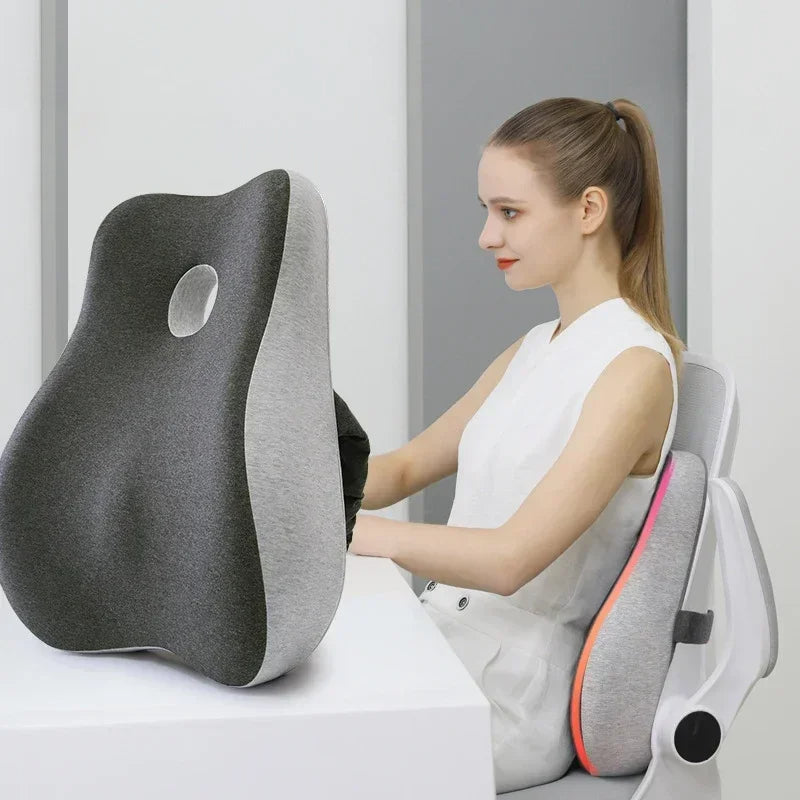Woman using a gray and black cushion with a white background