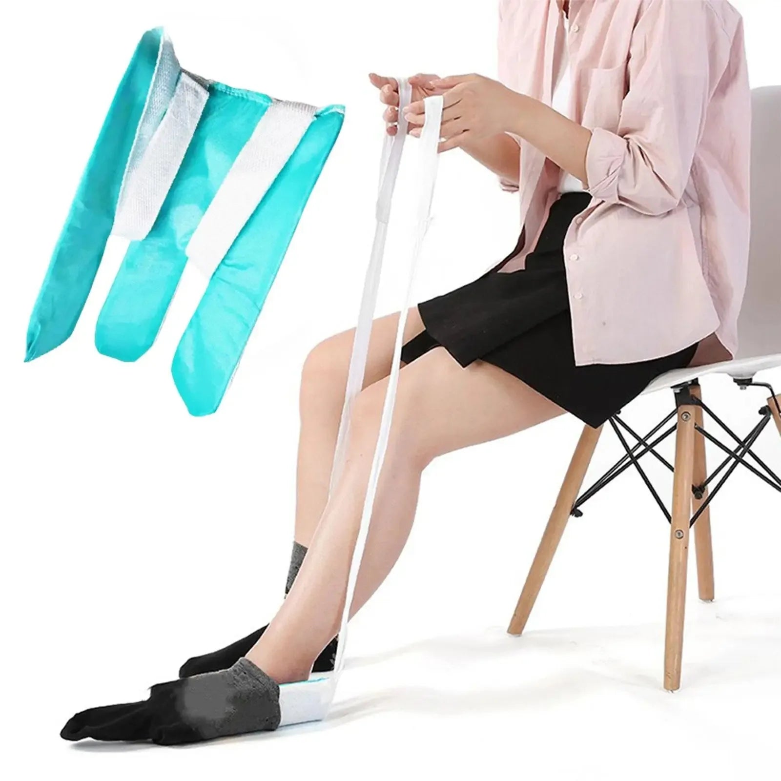 Person sitting on a chair using a white resistance band with teal and white resistance bands displayed.