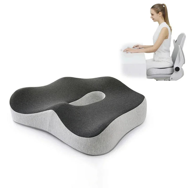 Gray and white seat cushion with a person using a chair in the background