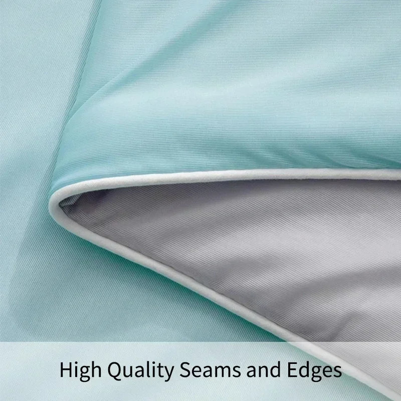 Close-up of high quality seams and edges on a fabric with a light blue and gray color scheme.