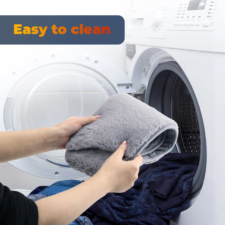 Person placing a gray towel into a washing machine with text 'Easy to clean' above.