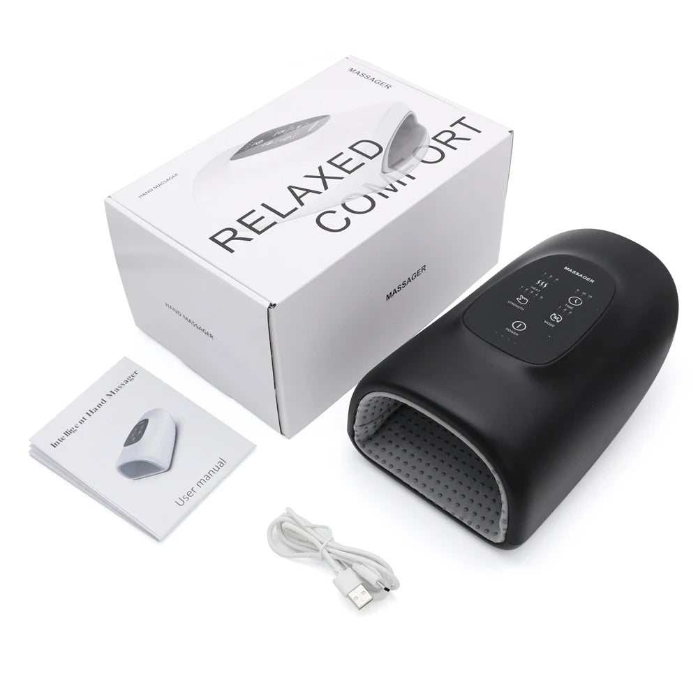 Black foot massager with packaging, user manual, and cable on a white background