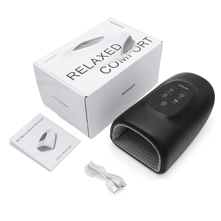 Black foot massager with packaging, user manual, and cable on a white background