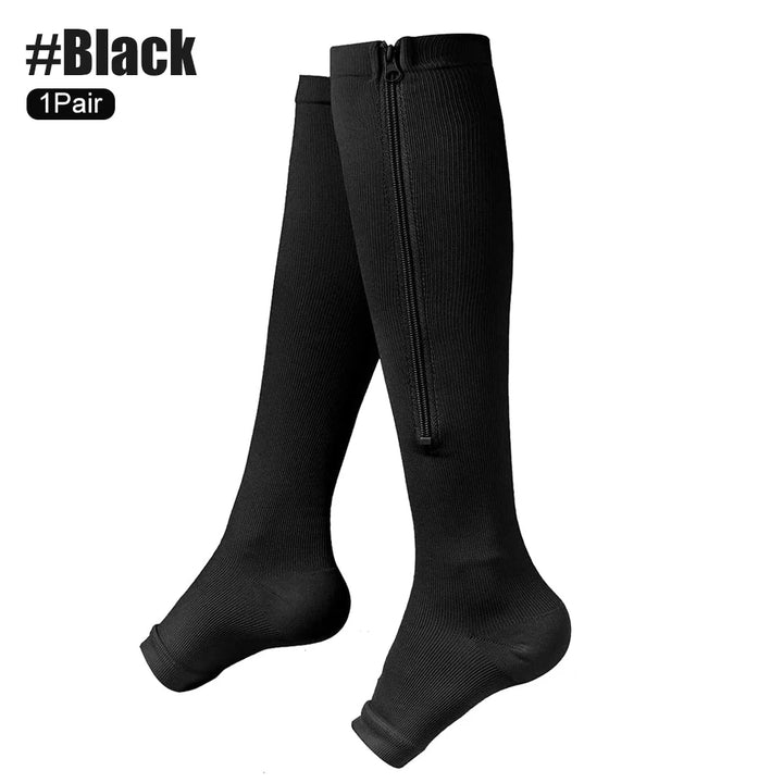 Black knee-high socks with a zipper on a white background