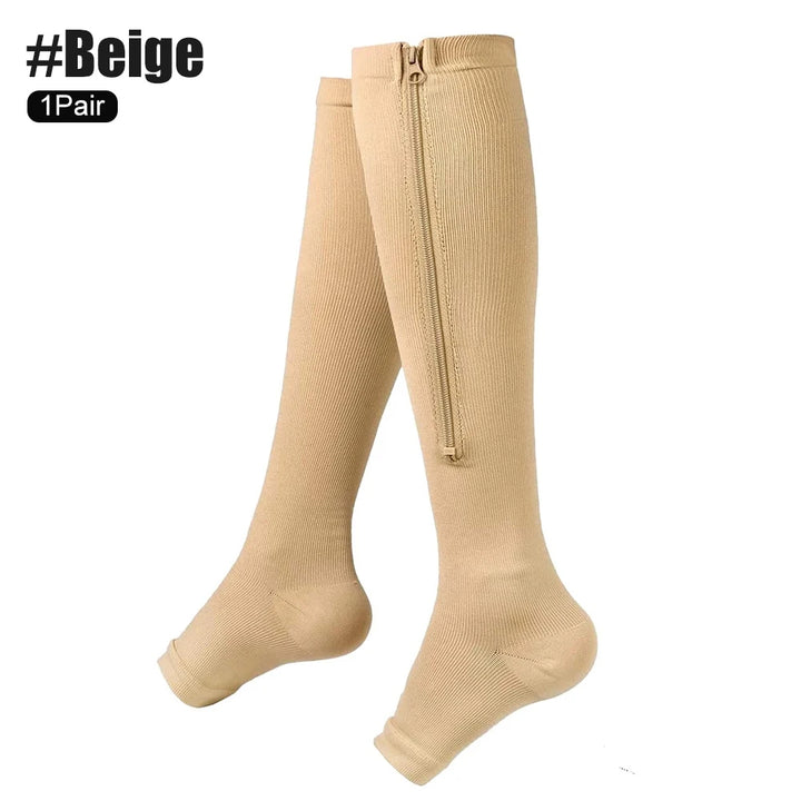 Beige knee-high socks with a zipper on a white background